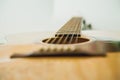 Classical guitar with vibrating strings on a white background