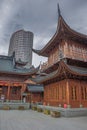 The classical Jade Buddha Temple with modern skyscraper