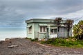 Classical kiwi bach on the ocean beach