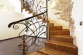 Classical mosaic stairs with ornamental handrail and stone decor Royalty Free Stock Photo