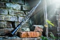 Classical music concept. Old clarinet in sunlight against background of ancient brick wall Royalty Free Stock Photo