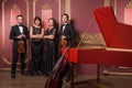 Classical music quartet posing after the concert. Royalty Free Stock Photo