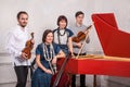 Classical music quartet posing after the concert. Royalty Free Stock Photo