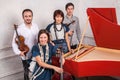 Classical music quartet posing after the concert.