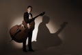 Classical musician studio portrait with double bass