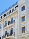 Classical old fashioned facades with elegant windows and balcony made in Portuguese architectural tradition. Vintage classy