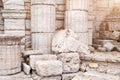 Classical old greek columns and wall background with stone floor and sculpture of a horse head Royalty Free Stock Photo