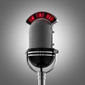 Classical retro microphone on the air on grey background