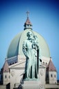 Classical statue of Saint Joseph with child Jesus on St Joseph Oratory background, Montreal, Canada Royalty Free Stock Photo