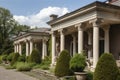 classical-style house with verandas, columns and classical urns