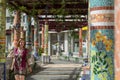 Classical tiled artistic spanish corridor with column in garden square. Art design attraction in landmark. Tile pillar in plaza