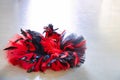 Classical tutu red and black with plumage isolated on grey Royalty Free Stock Photo