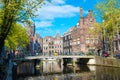 Classical view of traditional buildings at the canal side in Amsterdam downtown. Royalty Free Stock Photo