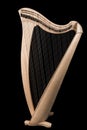 Classical wooden harp isolated on black background