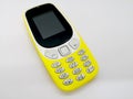 Classical yellow mobile phone. Communication concept. o Royalty Free Stock Photo