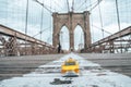 Classical yellow taxi model on an empty Brooklyn Bridge during lockdown in New York, because of the pandemic Royalty Free Stock Photo