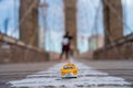 Classical yellow taxi model on an empty Brooklyn Bridge during lockdown in New York, because of the pandemic Royalty Free Stock Photo