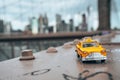 Classical yellow taxi model on an empty Brooklyn Bridge Royalty Free Stock Photo