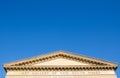 Classically elegant Art Gallery of New South Wales, the image shows the roof of it with blue sky background.