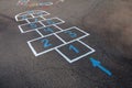 Multicolored classics painted on the tarmac of the schoolyard.