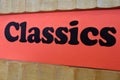 Classics Red Sign Background on a book shelf