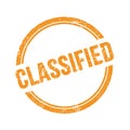 CLASSIFIED text written on orange grungy round stamp Royalty Free Stock Photo