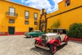 Classis cars on courtyard of castle in Funchal town, Madeira