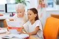 Classmates doing their homework together at home