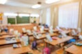 Classroom in a blurred background with no children. Students left their backpacks and notebooks and went on a break Royalty Free Stock Photo