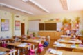 Classroom in a blurred background with no children. Students left their backpacks and notebooks and went on a break