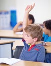 Classroom, child and raise hand for questions, support and help with education and teaching in school or classroom