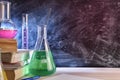 Classroom desk and blackboard of chemistry teaching close up Royalty Free Stock Photo