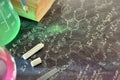 Classroom desk and drawn blackboard of chemistry teaching top Royalty Free Stock Photo