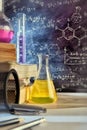 Classroom desk and drawn blackboard of chemistry teaching vertical Royalty Free Stock Photo