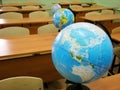 Globes on desks in school class
