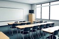 Classroom interior with empty whiteboard and black chairs Royalty Free Stock Photo