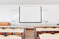 Classroom interior with projection screen, white board and wooden desks