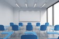 A classroom or presentation room in a modern university or fancy office. Blue chairs, a whiteboard on the wall and panoramic windo