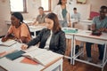 Classroom, students group and study in diversity school for education, learning and knowledge of books, writing and Royalty Free Stock Photo