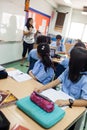 In the classroom, students listen to their teacher.