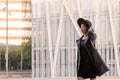 Classy asian woman in hat walking by the city Royalty Free Stock Photo