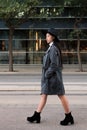 Classy asian woman walking in the city with hat Royalty Free Stock Photo