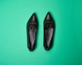 Classy black pointed-toe leather ballet flats with wrinkled and ruffle details Royalty Free Stock Photo