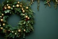 Classy Christmas wreath adorned with golden ornaments on a contrasting dark green wall. Generative AI