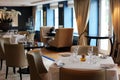 Classy elegant and modern restaurant at Amsterdam, The Netherlands in Europe. Seats, tables and lamps at luxury premium hotel. Royalty Free Stock Photo