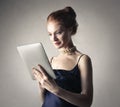 Classy woman using a tablet Royalty Free Stock Photo