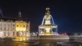 Fountain of three graces and building of the chamber of commerce, on the Place de la Bourse in Bordeaux, at night in Gironde, New Royalty Free Stock Photo