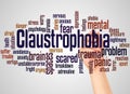 Claustrophobia fear of confined spaces word cloud and hand with marker concept