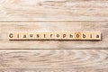 Claustrophobia word written on wood block. claustrophobia text on table, concept Royalty Free Stock Photo