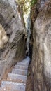 Claustrophobic narrow stairs through a sandstone crevice, Saxony